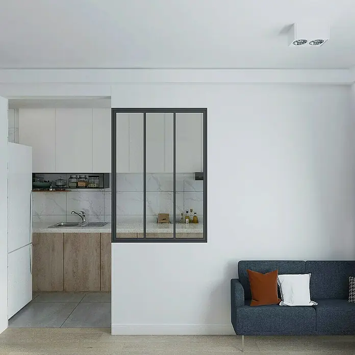 Inova Aluminiumfenster Loft Innenfenster Glas - 930 x 1.300 mm - Ein modernes Wohnzimmer mit blauem Sofa, Kissen und Blick durch eine Fensterwand in eine helle Küche.