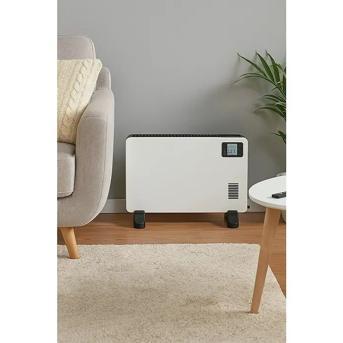 Voltomat HEATING Convector Design - 800 W - 2.200 W, 38,5 x 52 x 26 cm, Negro - Elegante calefactor blanco con pantalla digital en un salón con estilo.