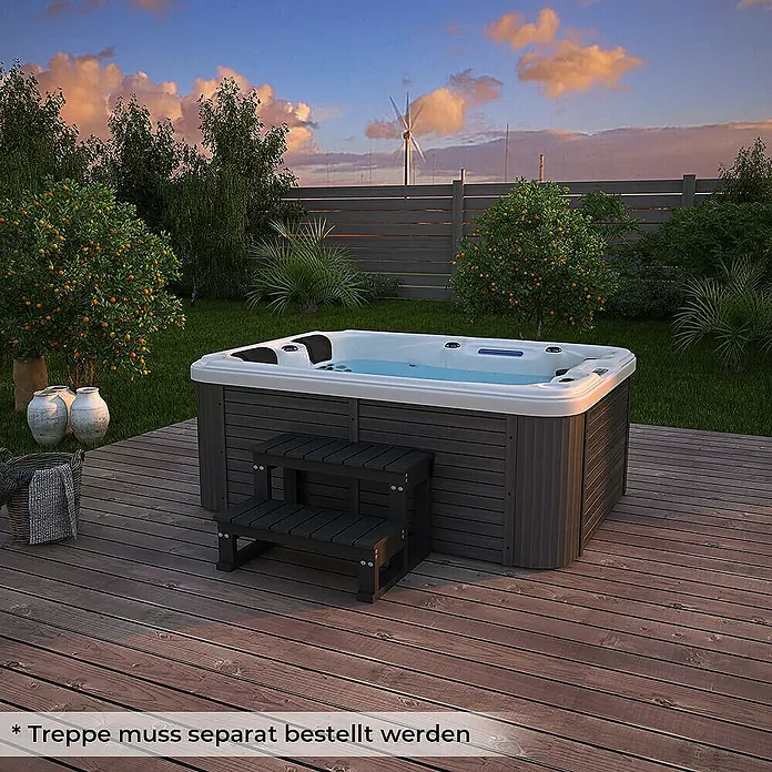 HOME DELUXE Outdoor Whirlpool BEACH Pure -  - Abbildung eines modernen Whirlpools mit grauer Verkleidung und passender Treppe auf einer Holzterrasse im Garten.