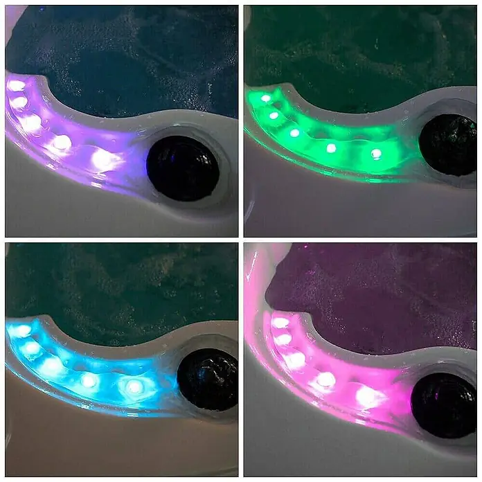 HOME DELUXE Outdoor Whirlpool BEACH Pure -  - Nahaufnahme eines Whirlpools mit LED-Beleuchtung, die verschiedene Farben wie Lila, Grün, Blau und Pink zeigt.\n