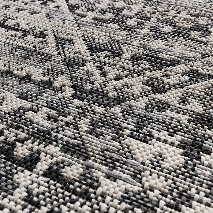 Dekoria Flachgewebeteppich - grau, schwarz, beige, 170 x 120 cm - Nahaufnahme eines strukturierten Teppichs mit einem komplizierten Schwarz-Weiß-Muster, der Textur und visuelles Interesse bietet.