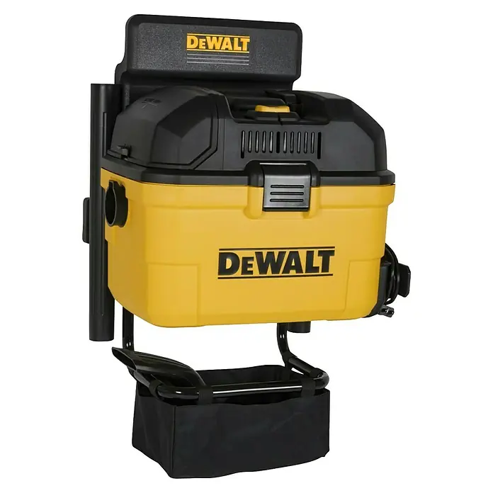 DeWalt Elektro-Nass- & Trockensauger DXV23G - 230 W, Behältervolumen: 23 l - Abbildung eines gelben und schwarzen DeWalt Werkstattsaugers mit Zubehör, der auf einer Werkbank steht.