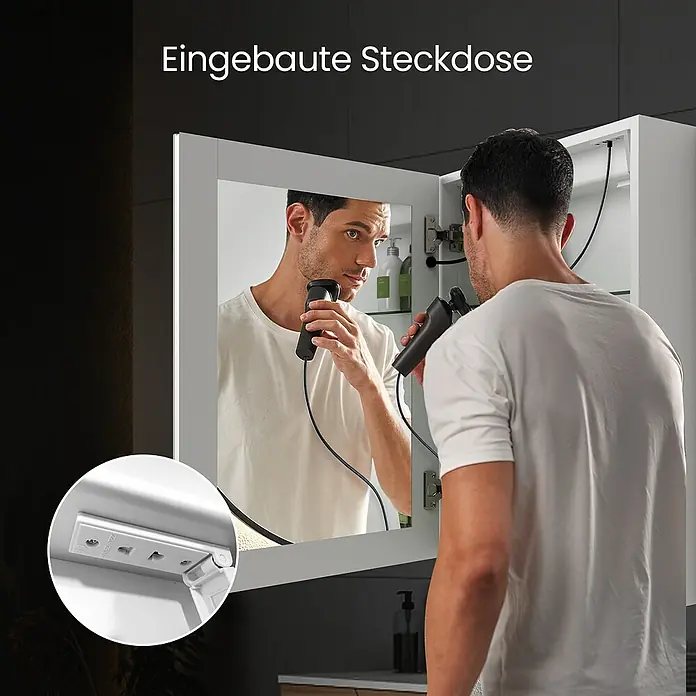 Emke LED-Spiegelschrank Auris - Aluminium, Silbrig - Spiegelschrank mit integrierter Steckdose, ein Mann rasiert sich mit einem Elektrorasierer.