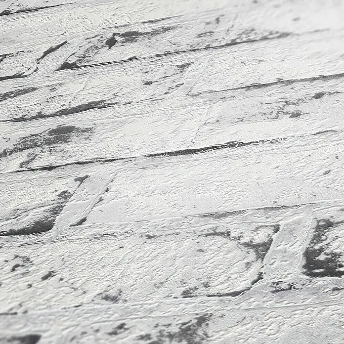 Tadessi Vliestapete M1-No.869 - Grau, Steinoptik, 10,05 x 0,53 m - Texturierte weiß-graue Oberfläche im Used-Look, die an gekalkte Ziegel oder Holzplanken erinnert.