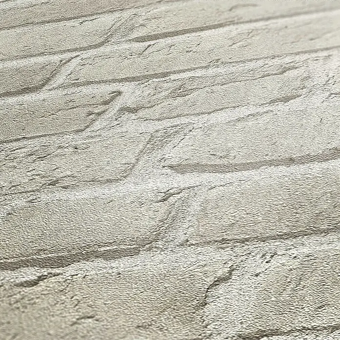 Tadessi Vliestapete M1-No.109 - Grau, Steinoptik, 10,05 x 0,53 m - Helle beigefarbene/graue, strukturierte Tapete mit Ziegelsteinmuster, die ein realistisches Steinmuster zeigt.