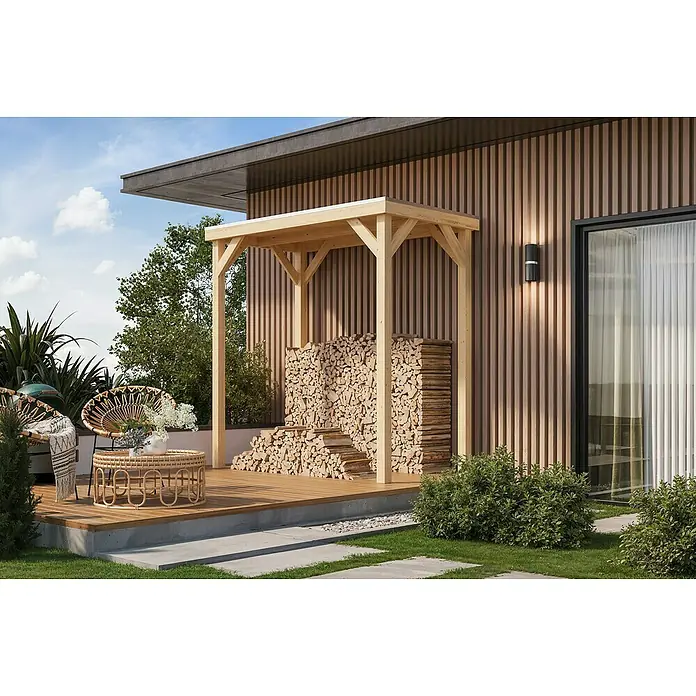 Karibu Gartenpavillon Cubeco - 231 x 124,5 cm, Holz, Natur - Außenansicht eines Holzschuppens, der an ein Haus angebaut ist, mit gestapeltem Brennholz unter einem schützenden Vordach.