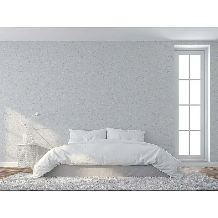 Tadessi Vliestapete M1-No.1496 - Grau, Steinoptik, 10,05 x 0,53 m - Weißes Bett mit frischer weißer Bettwäsche und Kissen in einem hellen, minimalistischen Schlafzimmer.