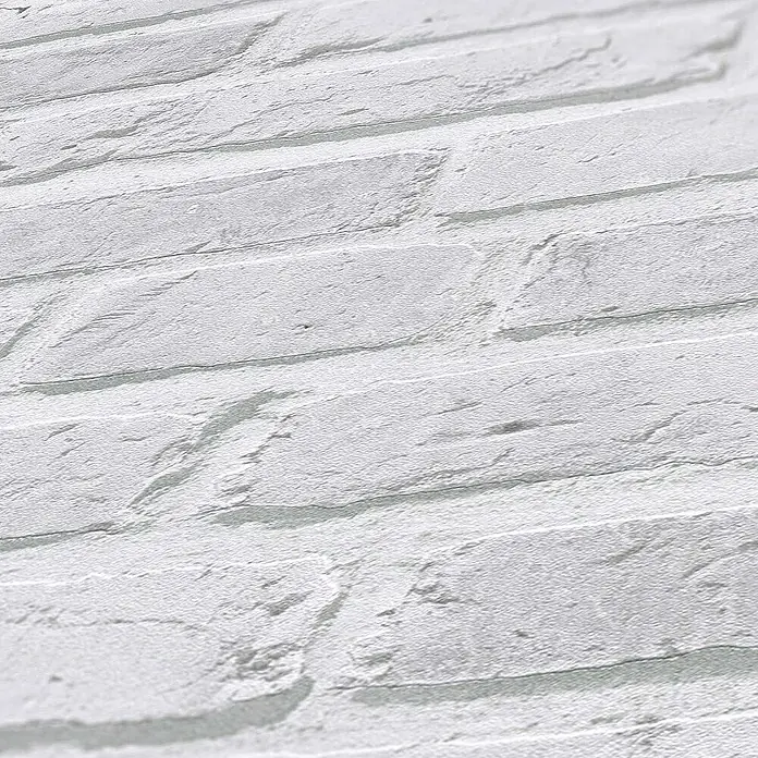 Tadessi Vliestapete M1-No.889 - Grau, Steinoptik, 10,05 x 0,53 m - Textur einer weißen Ziegelsteinwand mit rauen, unregelmäßigen Ziegeln.