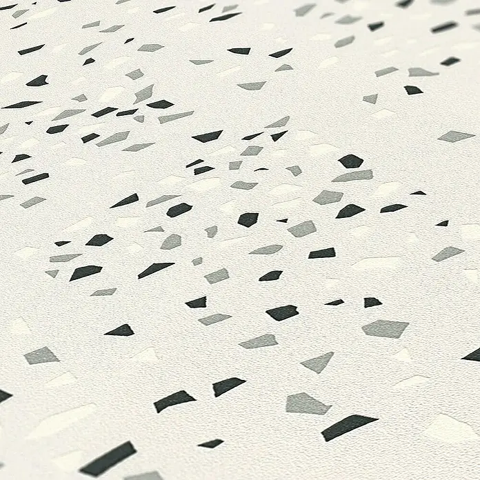 Tadessi Vliestapete M1-No.1657 - Schwarz, Grafisch, 10,05 x 0,53 m - Terrazzomuster mit hellem Hintergrund und grauen, dunkelgrauen sowie cremefarbenen Sprenkeln, texturierte Oberfläche.