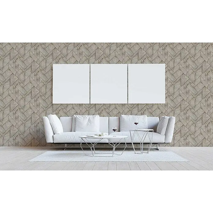 Tadessi Vliestapete M1-No.3235 - Braun, Steinoptik, 10,05 x 0,53 m - Modernes Wohnzimmer mit weißem Sofa, minimalistischen weißen Tischen und drei weißen Leinwänden an einer grau gemusterten Wand.