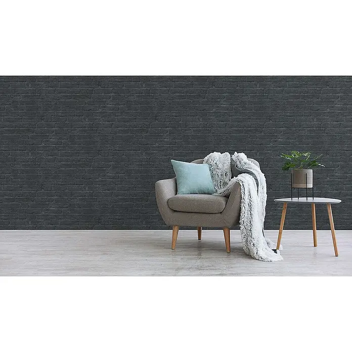 Tadessi Vliestapete M1-No.1415 - Schwarz, Steinoptik, 10,05 x 0,53 m - Dunkelgraue Ziegelstein-Tapete mit texturierter Oberfläche, als stilvolle Wandverkleidung in einem modernen Raumambiente.