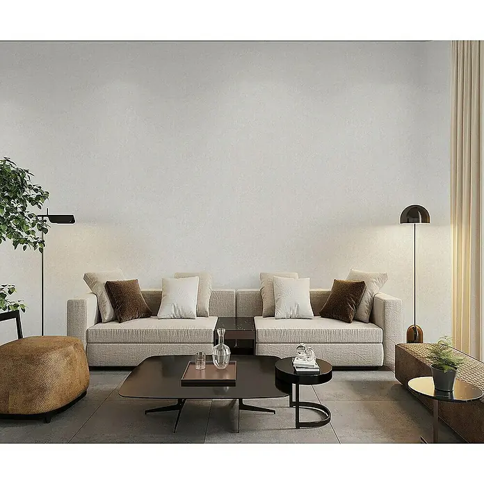 Tadessi Vliestapete M1-No.4407 - Grau, Sonstiges, 10,05 x 0,53 m - Moderner Wohnraum mit beigem Sektionssofa, dunklen Couchtischen und Umgebungsbeleuchtung.