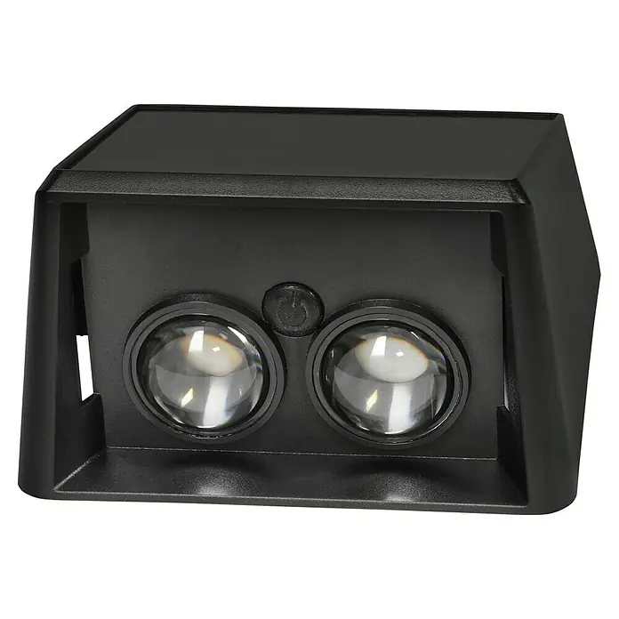 BAUHAUS Solar-Außenwandleuchte - L x B x H: 6,4 x 10,7 x 9,7 cm, Schwarz, IP65, 40 lm - Nahaufnahme einer schwarzen Solarleuchte mit zwei runden Linsen und einem Netzschalter in der Mitte.