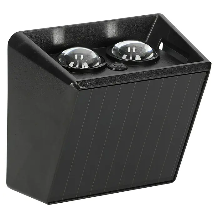 BAUHAUS Solar-Außenwandleuchte - L x B x H: 6,4 x 10,7 x 9,7 cm, Schwarz, IP65, 40 lm - Nahaufnahme einer schwarzen Solarleuchte mit zwei Linsen und einem Bedienknopf oben. Geeignet für den Außenbereich.