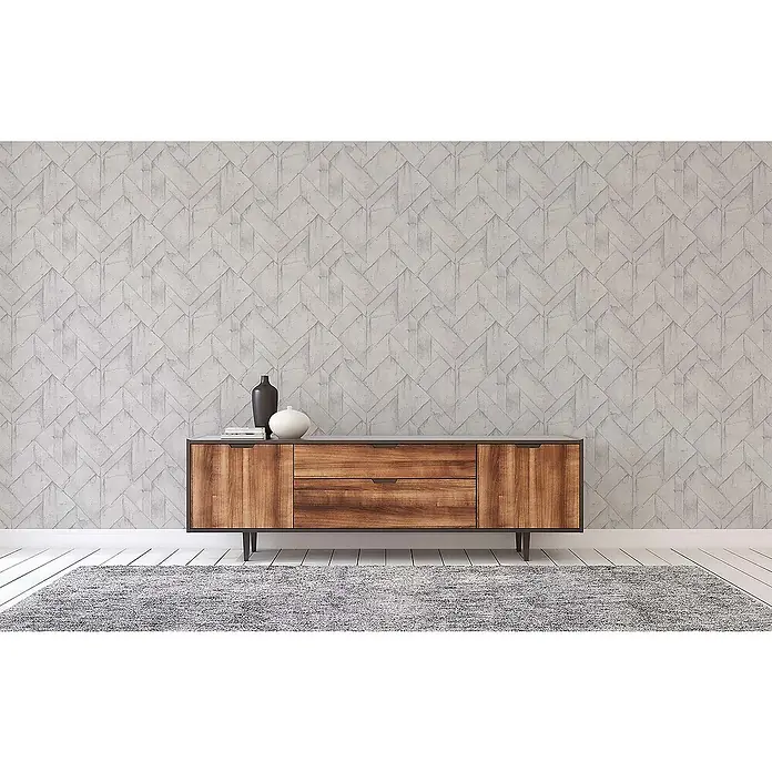 Tadessi Vliestapete M1-No.544 - Grau, Steinoptik, 10,05 x 0,53 m - Warmtöniges Sideboard aus Holz mit Schubladen und Schranktüren, dunkler Rahmen, in einem modernen Wohnraum.