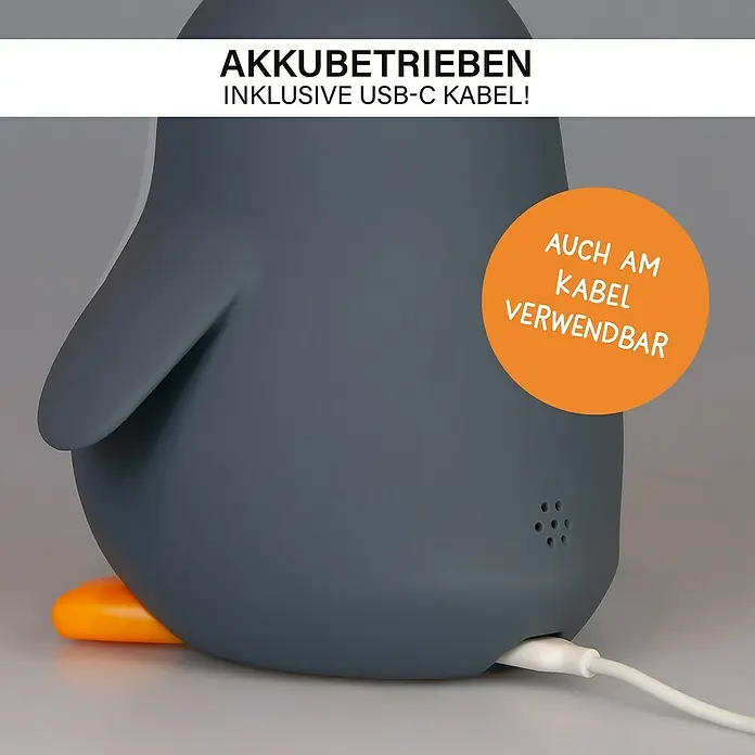 MegaLight Nachtlicht Wecker Poppy Penguin - Schwarz, Weiß, 14,8 x 13,8 cm - Nahaufnahme einer grauen Pinguinlampe, die über USB aufladbar ist und auch mit einem Kabel verwendet werden kann.