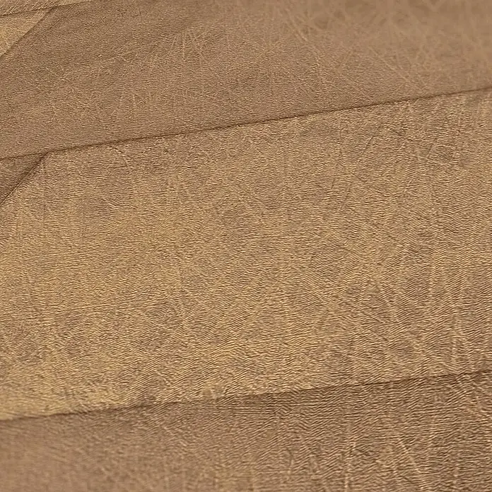 Tadessi Vliestapete M1-No.3393 - Braun, Steinoptik, 10,05 x 0,53 m - Strukturiertes braunes Material mit sichtbaren Nähten, das an abgenutztes Leder erinnert.