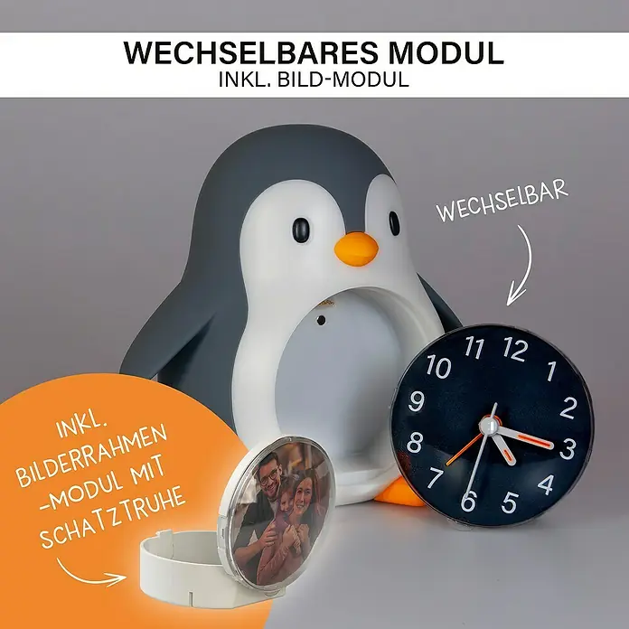 MegaLight Nachtlicht Wecker Poppy Penguin - Schwarz, Weiß, 14,8 x 13,8 cm - Produktfoto eines Pinguin-Nachttischlichts mit austauschbaren Modulen, darunter ein Bilderrahmen und eine Uhr.