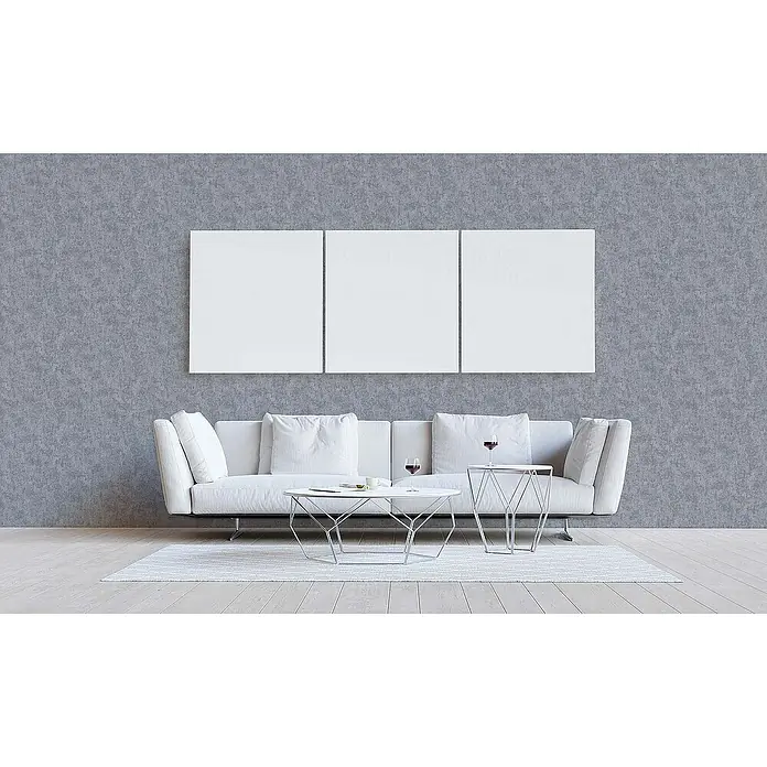Tadessi Vliestapete M1-No.15 - Grau, Steinoptik, 10,05 x 0,53 m - Modernes weißes Sofa, zwei geometrische Couchtische und leere Leinwände in einem minimalistischen Wohnzimmer.