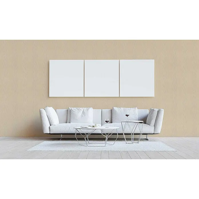 Tadessi Vliestapete M1-No.3805 - Gelb, Streifen, 10,05 x 0,53 m - Drei leere weiße Leinwände nebeneinander über einem modernen weißen Sofa und Couchtischen in einem Wohnzimmer.