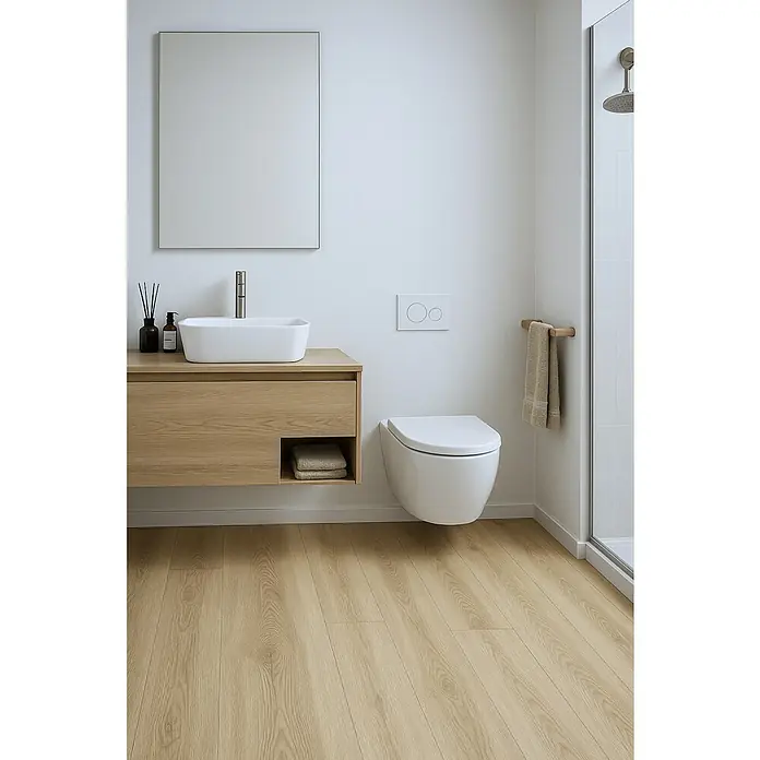 Suelo vinílico SPC Old Wood Tree - 1.220 x 180 x 5 mm, Marrón, Resistente al agua - Un baño moderno con un tocador flotante de madera clara, un lavabo rectangular y un inodoro suspendido, todo en un diseño minimalista.