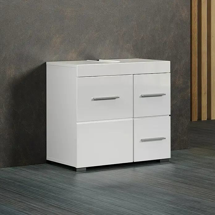 Trendteam Bea Waschtischunterschrank - B x T x H: 60 x 34 x 56 cm, Weiß, Ausstattung: 1 Tür - Weißer Waschtischunterschrank mit vier Schubladen und silbernen Griffen vor dunkler Wand.