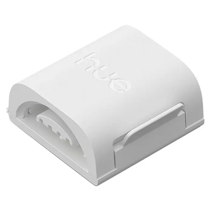 Philips Hue Steckverbinder Flux - L x B x H: 2 cm x 2,8 cm x 8 mm - Eine Nahaufnahme eines weißen Philips Hue Bridge-Geräts, das für die Steuerung von smarten Beleuchtungssystemen verwendet wird.
