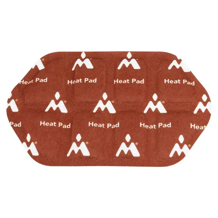 Montandor Heizkissen Heat Pad-Nachfüllpack - 6 Stk., 13 x 20 cm - Nahaufnahme eines ovalen Wärmepflasterstreifens mit der Aufschrift "Heat Pad" und einem stilisierten Bergsymbol.