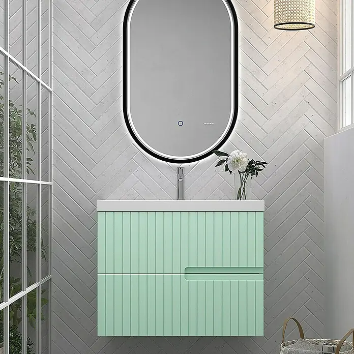 Duplach Mueble bajo de lavabo Abi - L x An x Al: 45 x 80 x 60 cm, Menta - Elegante interior de baño con un moderno tocador verde menta y un elegante espejo ovalado con iluminación LED.