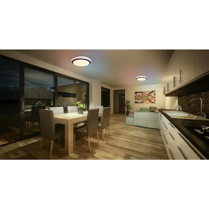 Osram Smart+ LED-Deckenleuchte rund Orbis Zest - Ø x H: 49 x 10 cm, Schwarz, RGBW - Innenaufnahme eines modern eingerichteten Wohnraums mit einer runden Deckenleuchte, einem Esstisch und einer stilvollen Küchenzeile.