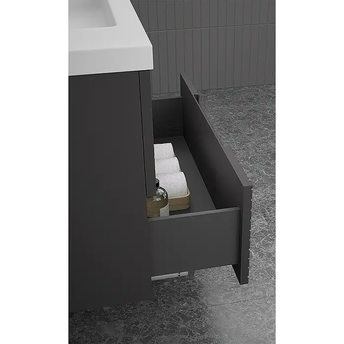 Duplach Mueble bajo de lavabo Kamet - L x An x Al: 45 x 60 x 60 cm, Antracita - Primer plano de un tocador de baño moderno con un cajón que contiene toallas y artículos de aseo.