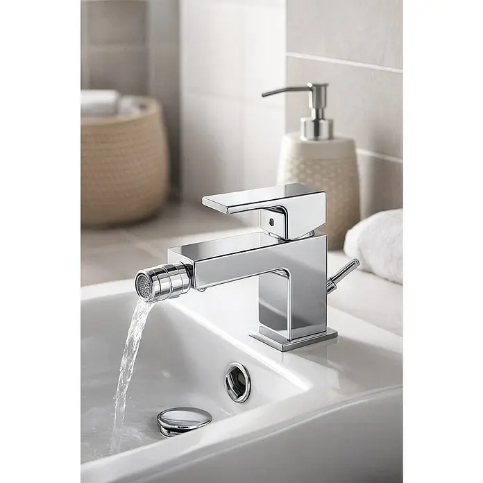 Hansgrohe Vernis Shape Grifo monomando de bidé - Cromo, Resplandeciente - Grifo cromado con función de bidé y agua corriente en un lavabo blanco.
