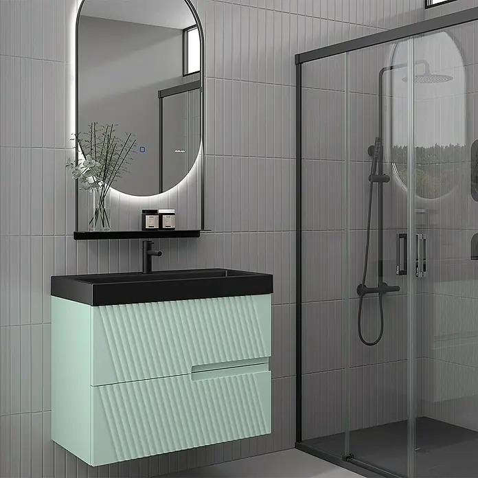 Duplach Mueble bajo de lavabo Saser - L x An x Al: 45 x 60 x 60 cm, Menta - Moderno tocador de baño con cajones verde menta, un lavabo negro y un espejo con iluminación.