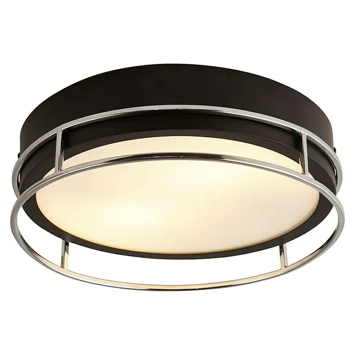 Searchlight Deckenleuchte rund Phoenix - 60 W, Ø x H: 30 x 9,5 cm, Schwarz/ Chrom - Nahaufnahme einer modernen Deckenleuchte mit runder, schwarzer Basis und chromfarbenem Metallrahmen, die ein warmes Licht ausstrahlt.