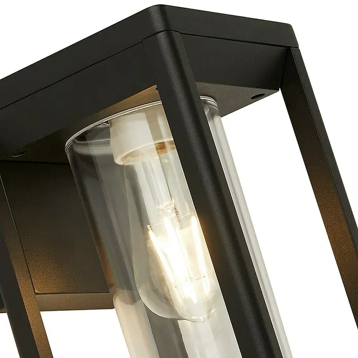 Searchlight Außenwandleuchte Atlanta - 15 W, 16,5 x 15 x 27 cm, Schwarz, IP44 - Nahaufnahme einer stilvollen schwarzen Außenleuchte mit einer klaren Glasabdeckung, die eine Vintage-Glühbirne zeigt.