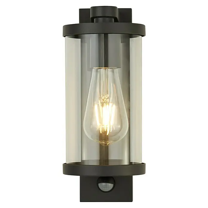 Searchlight Sensor-Außenleuchte Bakerloo - 60 W, 16 x 12 x 29 cm, Schwarz, IP44 - Nahaufnahme einer modernen schwarzen Außenwandleuchte mit klarem Zylinderglas und einer dekorativen Glühbirne.