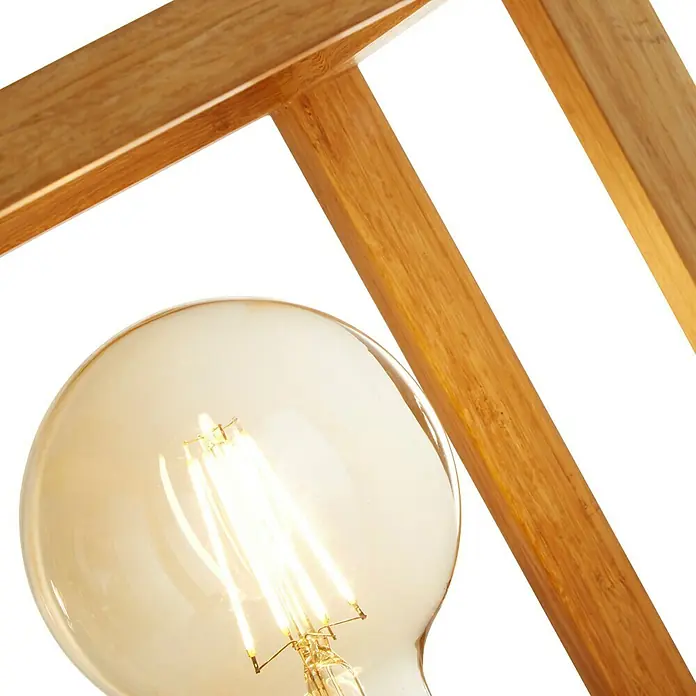 Searchlight Tischleuchte Square - 60 W, L x B x H: 25 x 20 x 25 cm, Braun, E27 - Nahaufnahme einer dekorativen Glühbirne in einem Holzrahmen, die ein warmes und einladendes Licht ausstrahlt.
