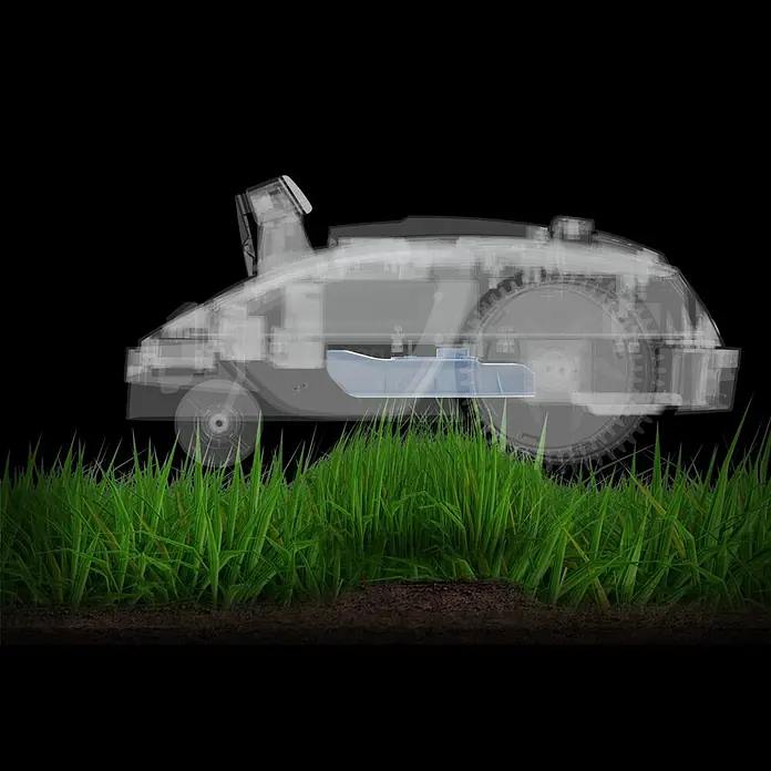 Sunseeker Mähroboter-Set V3 inkl. Garage - 600 m², Schnittbreite: 18 cm, Kamera-gestützte Navigation - Röntgenbild eines Rasenmähroboters im Einsatz. Der Rasenmähroboter steht auf Rasen mit Erde und mäht.