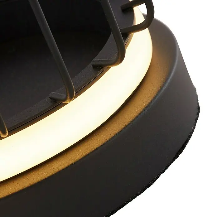 Searchlight LED-Tischleuchte rund Circolo - 12 W, Ø x H: 16 x 33 cm, Schwarz/ Weiß, Warmweiß - Detailaufnahme einer stilvollen schwarzen Leuchte mit warmem, indirektem Licht, das eine gemütliche Atmosphäre schafft.