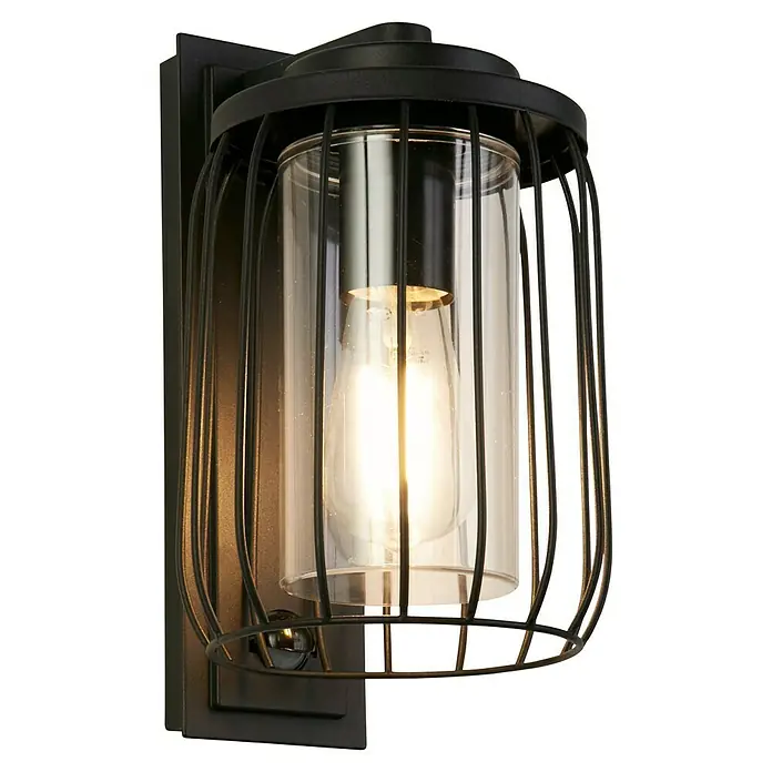 Searchlight Wandleuchte Reed - 40 W, L x B x H: 16 x 16 x 27,2 cm, Schwarz - Nahaufnahme einer Wandleuchte mit Käfigdesign und klarem Zylinderglas, das eine Edison-Glühbirne umgibt.