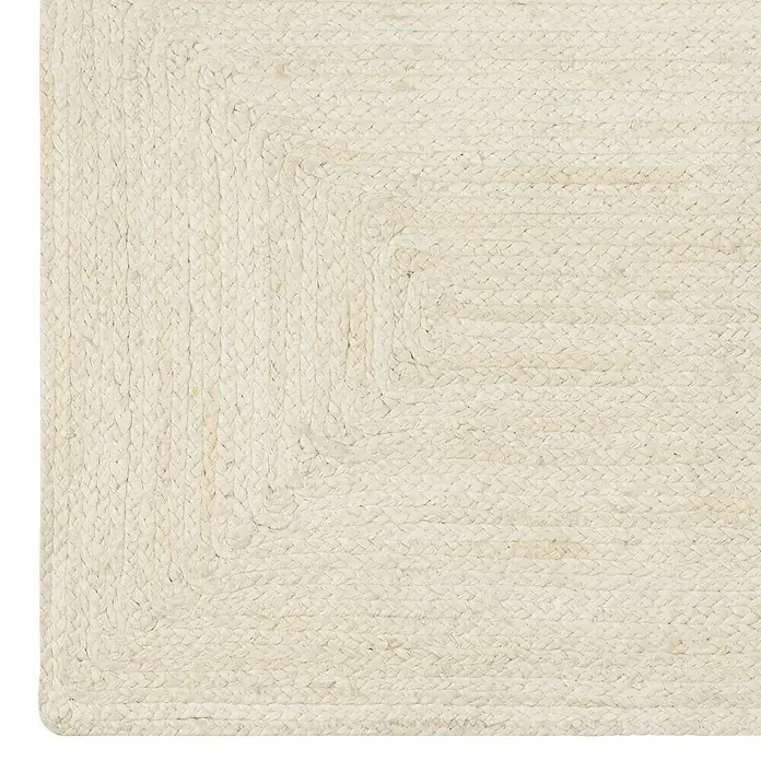 Alfombra de yute Nazar - Multicolor, 110 x 60 cm - Detalle de una alfombra cuadrada de yute blanqueado, mostrando un diseño trenzado.