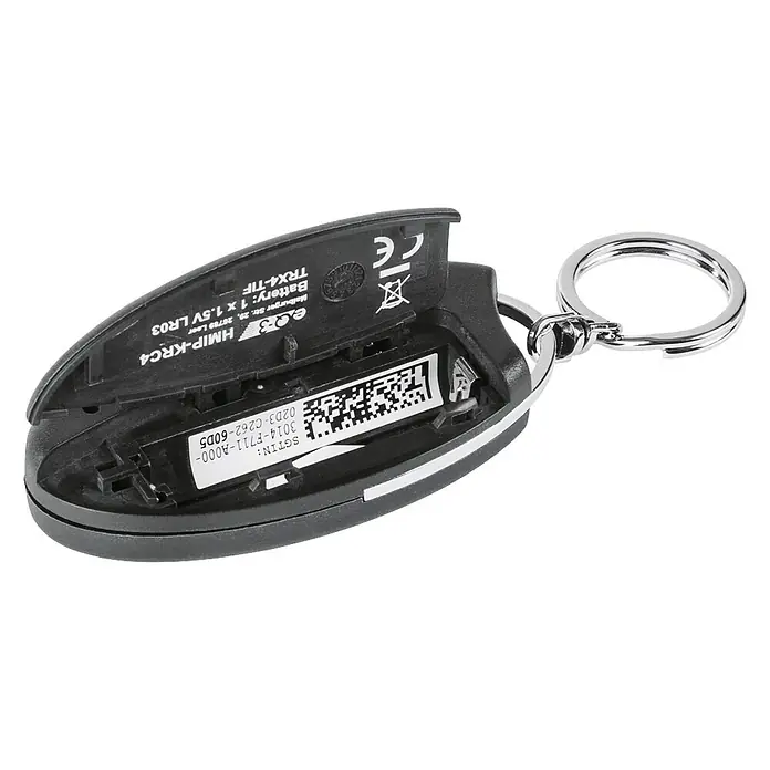 Homematic IP Funkfernbedienung Schlüsselanhänger HmIP-KRC4 - Schwarz, 14 x 38 x 75 mm - Nahaufnahme eines Homematic IP-Schlüsselanhängers HMIP-KRC4 mit offenem Batteriefach und sichtbarer Batterie.