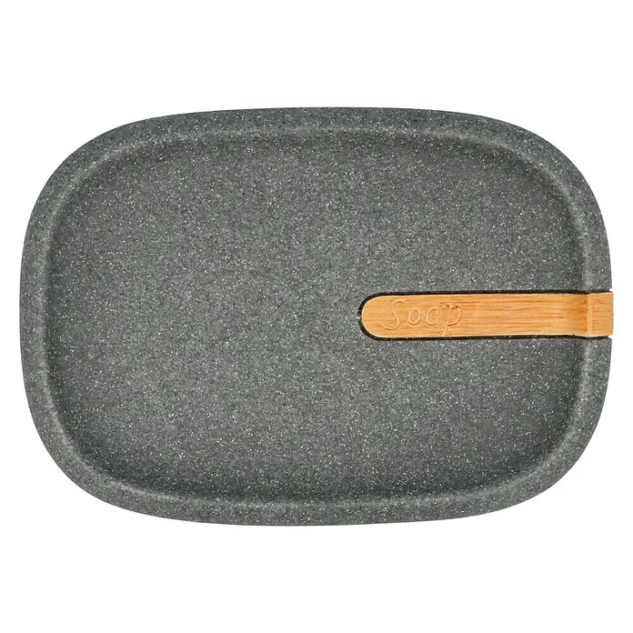 Venus Empire Seifenschale - Polyresin, Grau - Eine graue Seifenschale mit einem Holzstab, auf dem das Wort "Soap" steht. Die Seifenschale ist oval und hat eine raue Oberfläche.