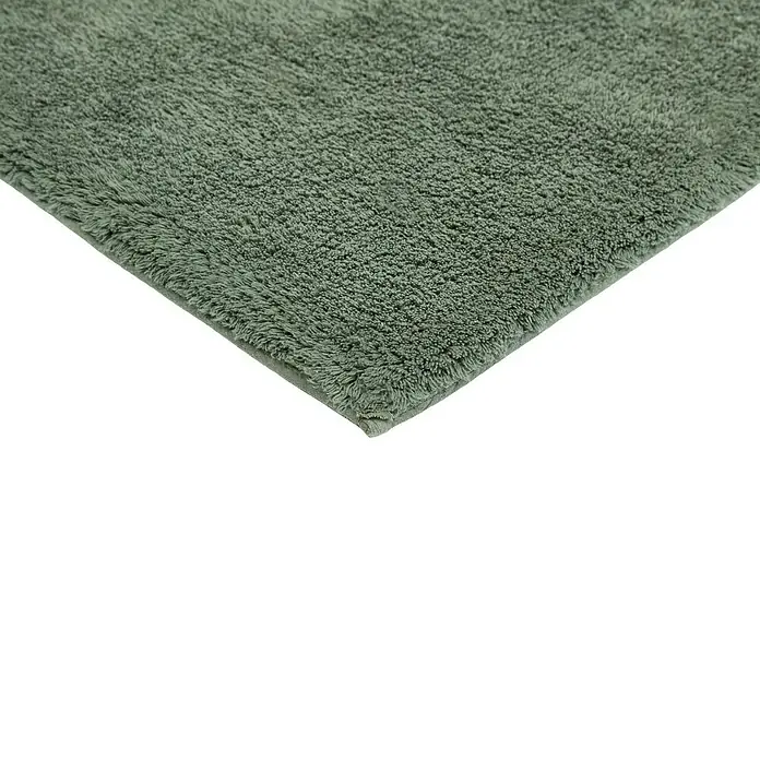 Badteppich Ibiza - 60 x 100 cm, Grün, 100% Baumwolle - Nahaufnahme eines grünen Badteppichs mit weicher Textur, der Komfort und Stil im Badezimmer bietet.