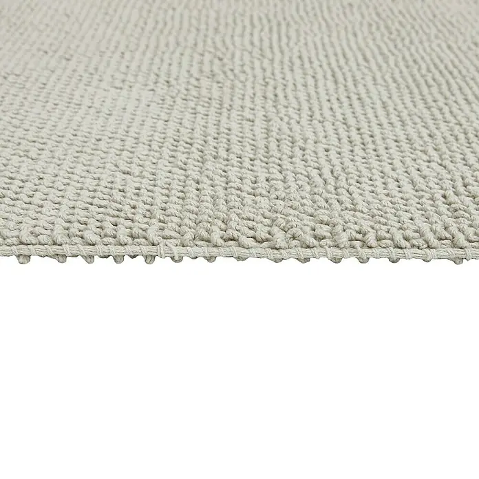 Badteppich Atlanta - 60 x 100 cm, 100% Baumwolle - Detailaufnahme eines beigen Teppichs mit gewebter Textur, ideal für Wohnräume.