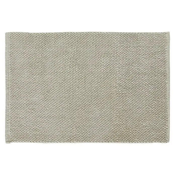 Badteppich Atlanta - 60 x 100 cm, 100% Baumwolle - Ein quadratischer, beiger Badteppich mit Noppenstruktur liegt flach auf dem Boden. Ideal für Badezimmer, bietet Komfort und Rutschfestigkeit.
