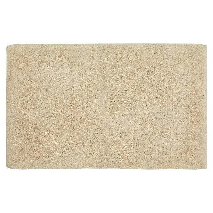 Badteppich Ibiza - 50 x 80 cm, Beige, 100% Baumwolle - Detailaufnahme eines beigen, rechteckigen Badezimmerteppichs mit flauschiger Textur und einem hellen, neutralen Farbton.