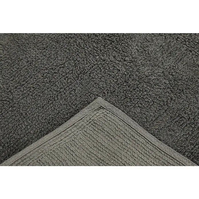 Badteppich Ibiza - 60 x 100 cm, Anthrazit, 100% Baumwolle - Nahaufnahme eines grauen Badteppichs mit flauschiger Textur und ordentlicher, rechteckiger Einfassung.