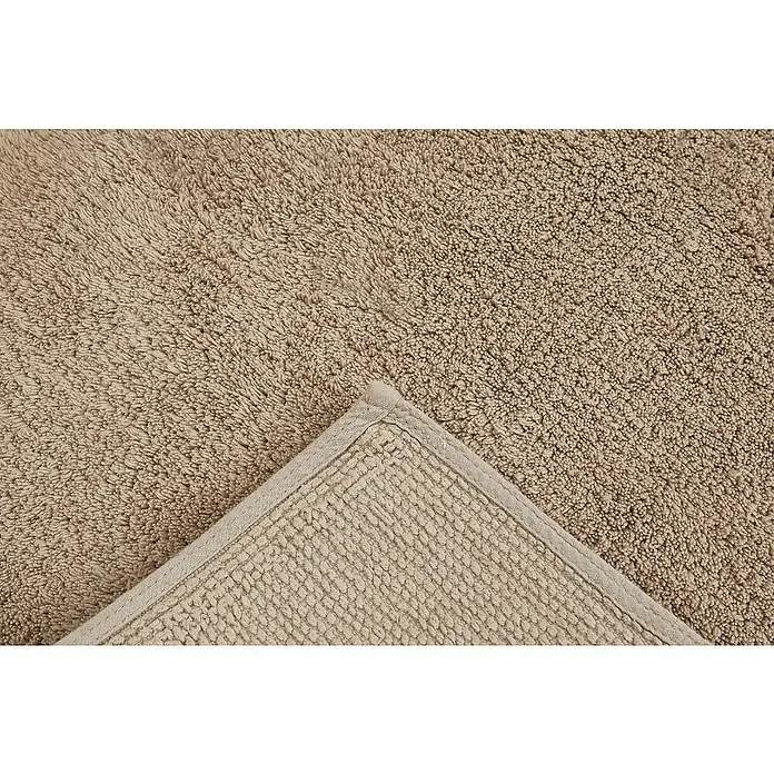 Badteppich Ibiza - 60 x 100 cm, Taupe, 100% Baumwolle - Nahaufnahme eines beigefarbenen Badteppichs mit Textur und Bordüre, der die weiche und saugfähige Beschaffenheit des Produkts hervorhebt.