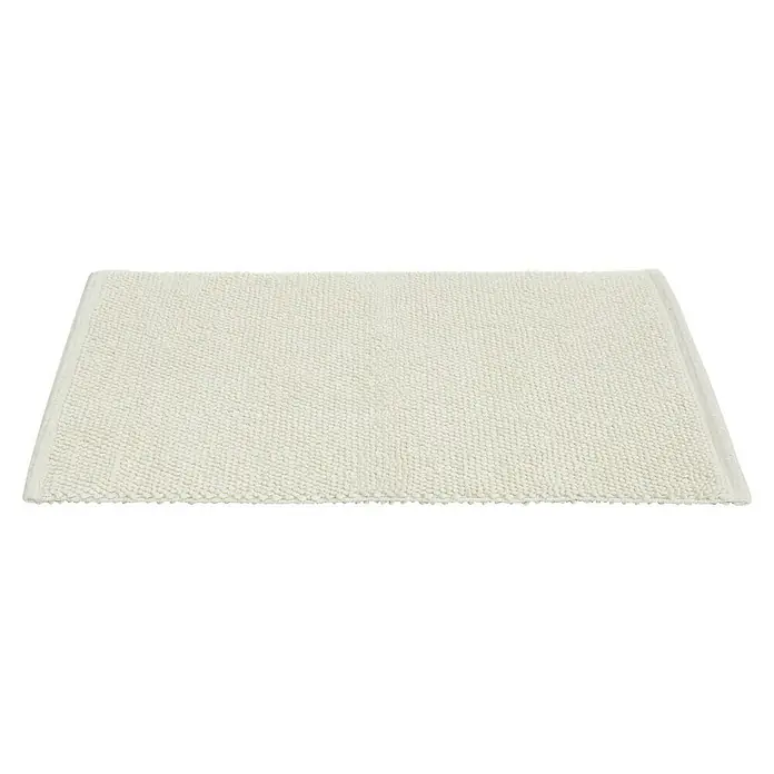 Badteppich Atlanta - 60 x 100 cm, Weiß, 100% Baumwolle - Nahaufnahme einer rechteckigen, elfenbeinfarbenen Badematte mit weicher Textur, die Komfort und Stil im Badezimmer bietet.